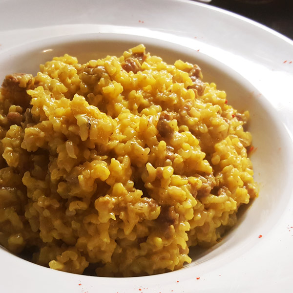 Brown rice risotto with sausage and saffron